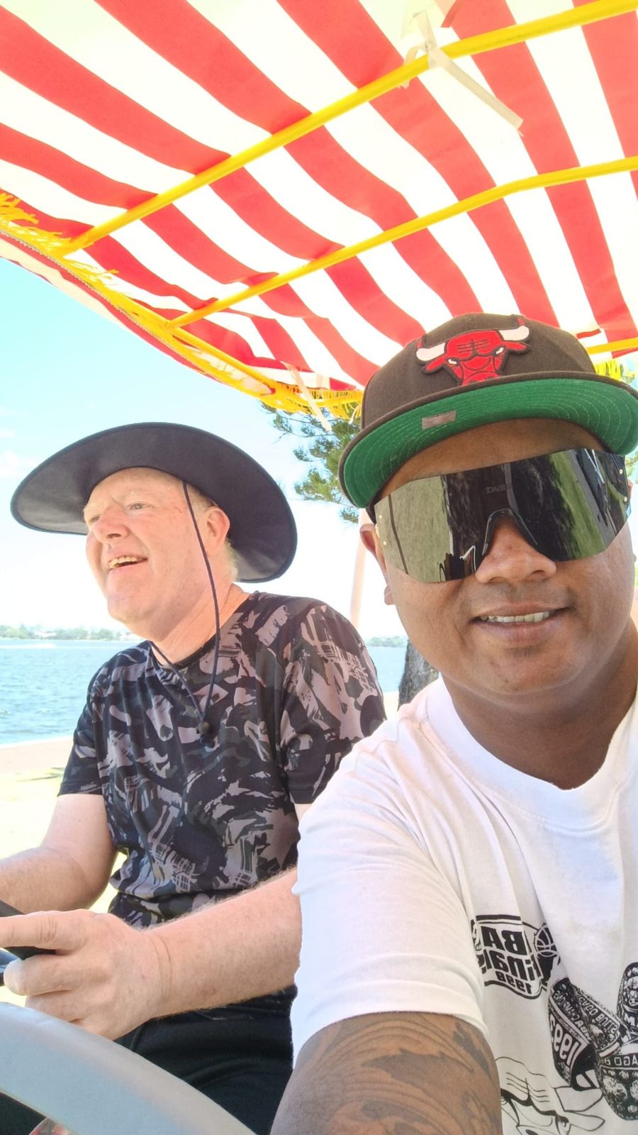 A Vel Care Alliance support worker and a teenager out on the water