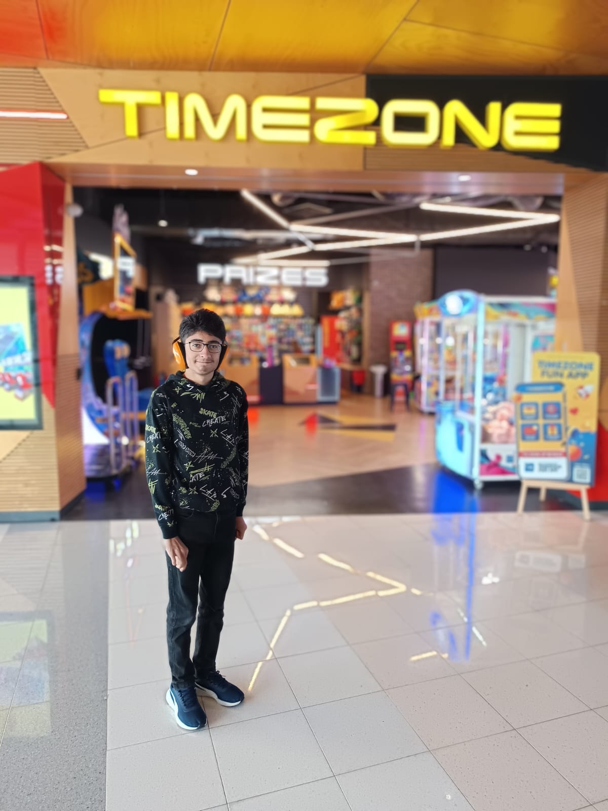 A teenager out in the community with a support worker